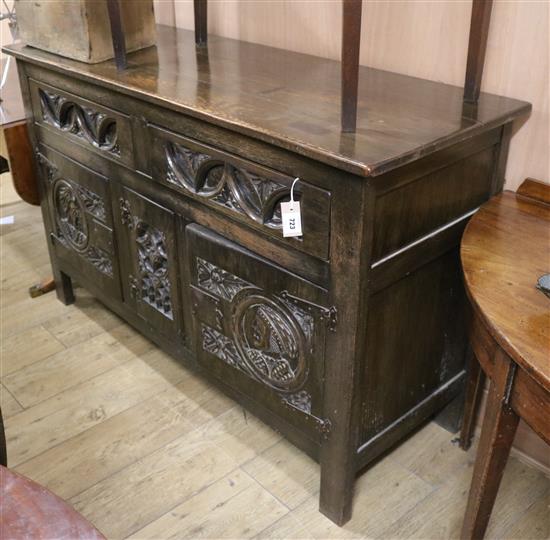 A reproduction carved oak sideboard W.146cm